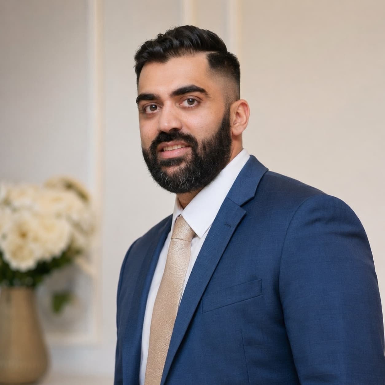 Gary Bajwa in a blue suit